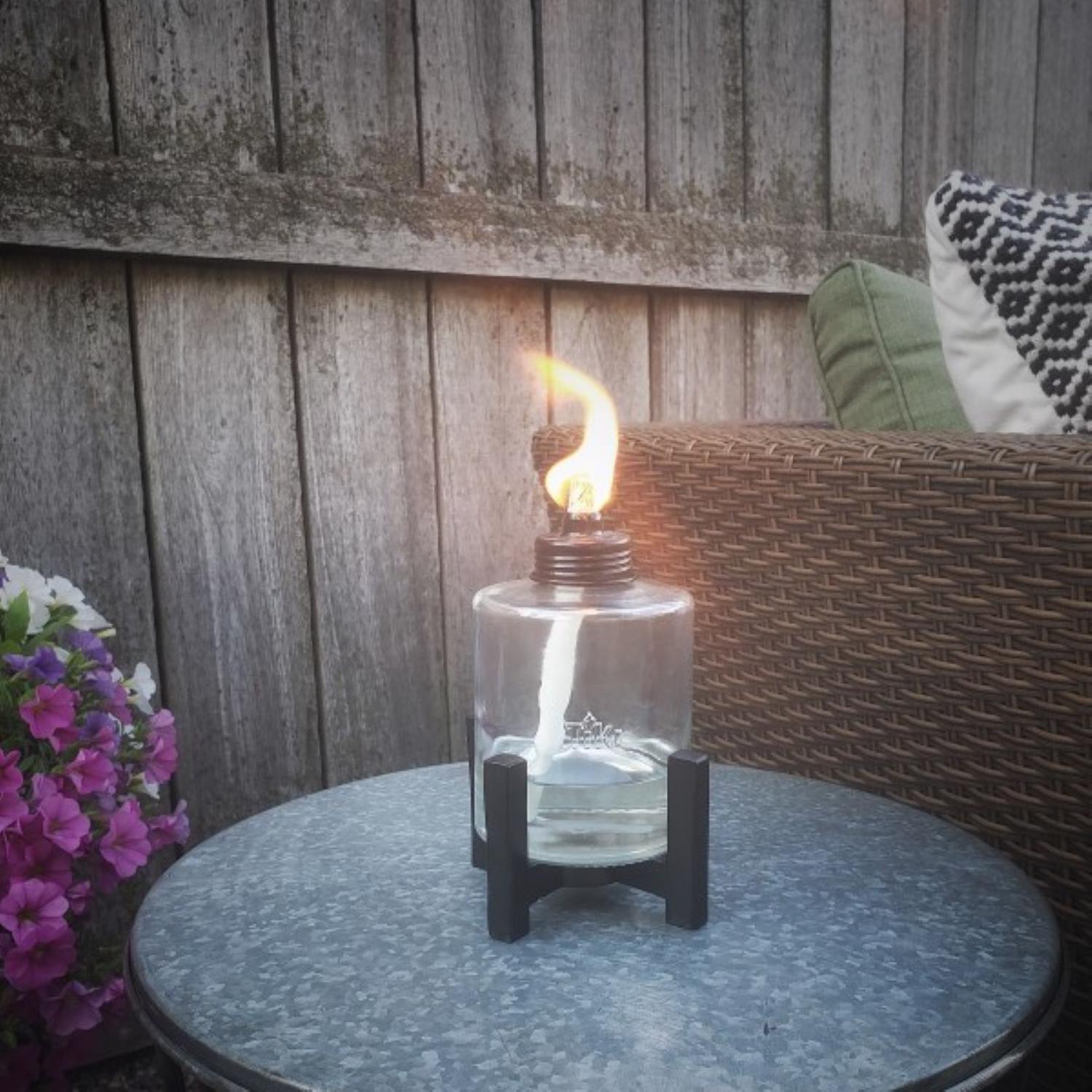 TIKI Black/Clear Glass/Metal 6.5 in. Elevated Tabletop Torch 1 pc