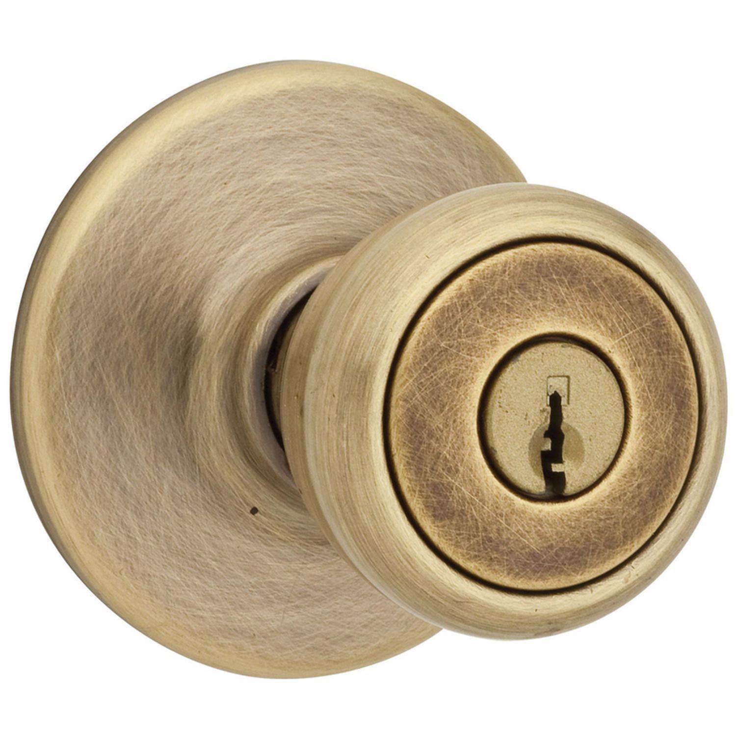 Kwikset Tylo Antique Brass Entry Door Knob 1-3/4 in.